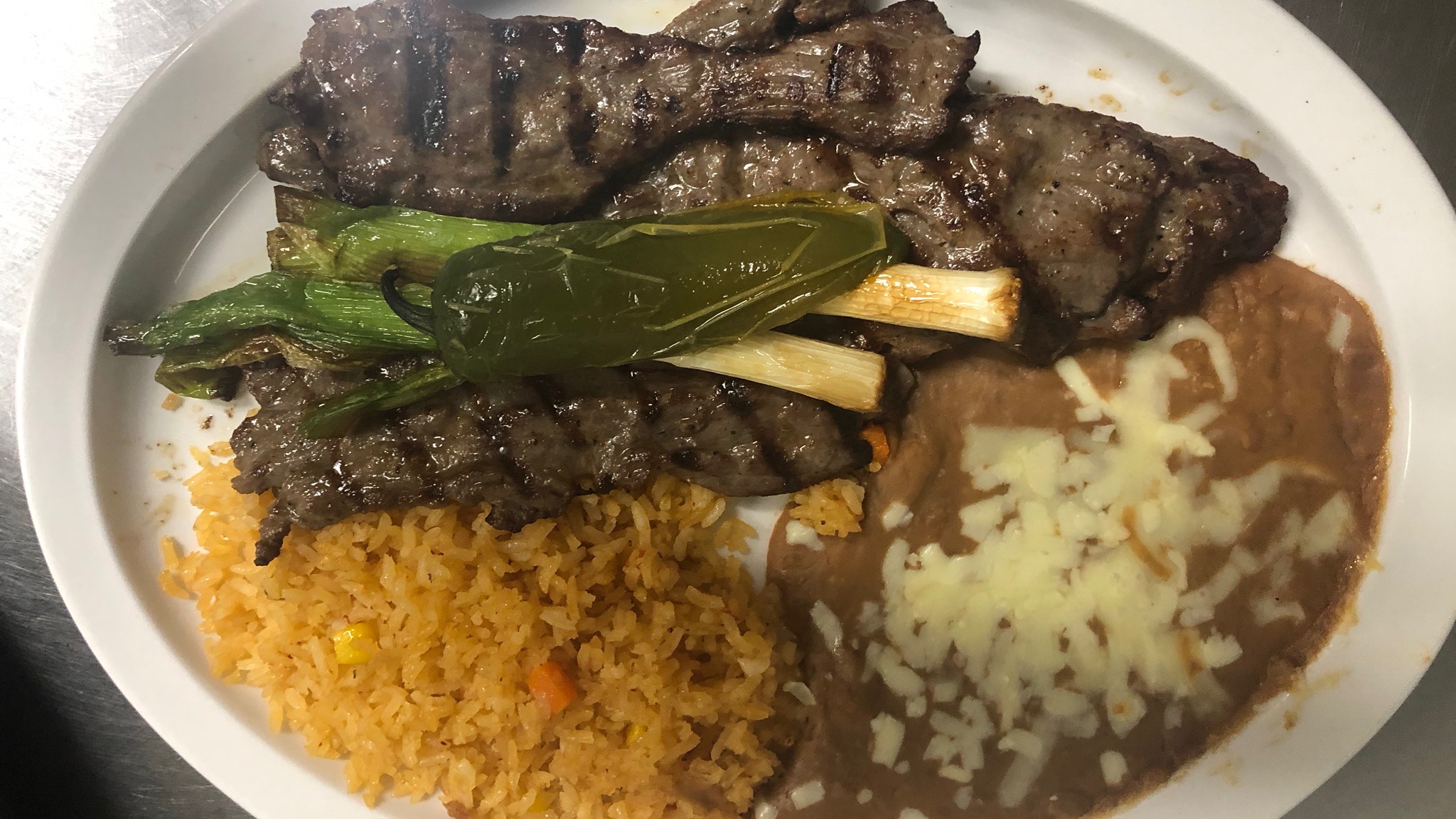 Riviera Maya Restaurant - Some menu items under 10 dollars. Full Beef  Nachos 9.75 Full Chicken Nachos 9.50 Soft/Hard Regular Tacos 9.75 Special  Burritos (2) 9.99 Taco Salad 9.75 Traditional Quesadilla 9.99 Prices are  for dine-in only.